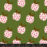 a repeating pattern of pink and white apples against a green background.