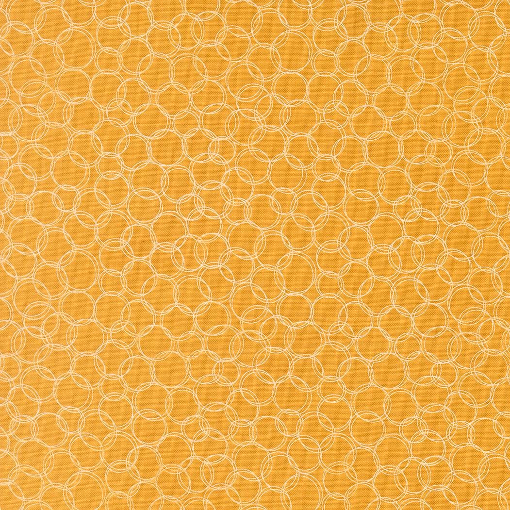 a repeating pattern of overlapping circles in various shades of yellow, creating a visually striking and textured design.