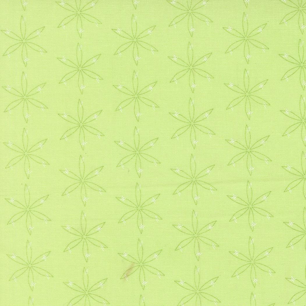 a repeating pattern of green flower-like shapes on a light green background.