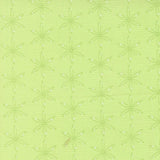 a repeating pattern of green flower-like shapes on a light green background.