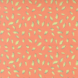 a repeating pattern of yellow and green leaf shapes on a peach-colored background.