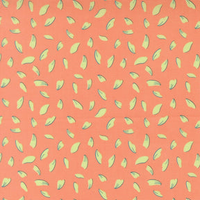 a repeating pattern of yellow and green leaf shapes on a peach-colored background.