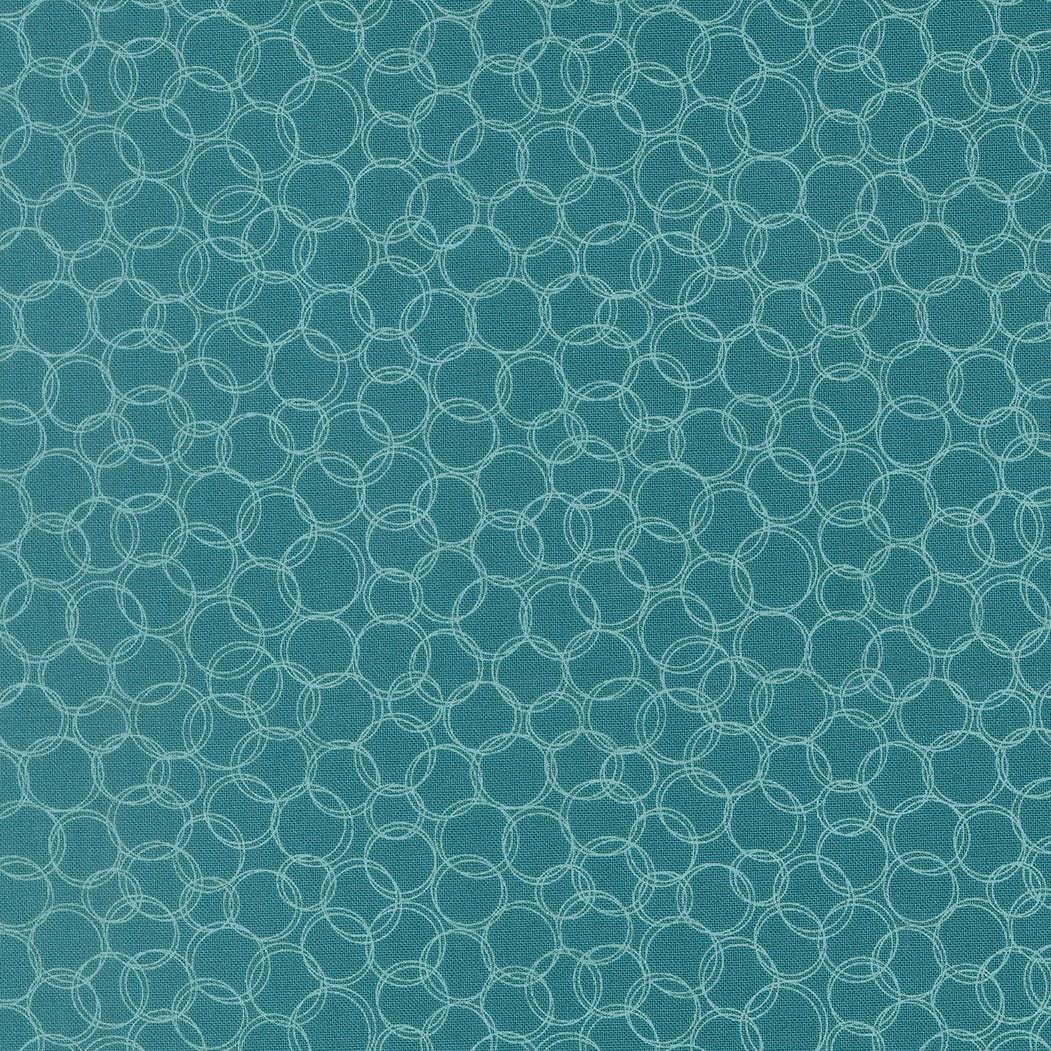 a repeating pattern of overlapping white circles on a teal-colored background.