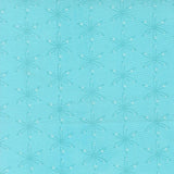 a repeating pattern of white star-like designs on a light blue background.