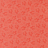 a repeating pattern of red flowers with white dots on a red background.