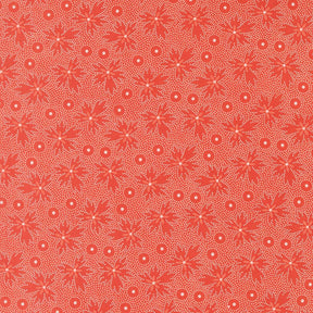 a repeating pattern of red flowers with white dots on a red background.