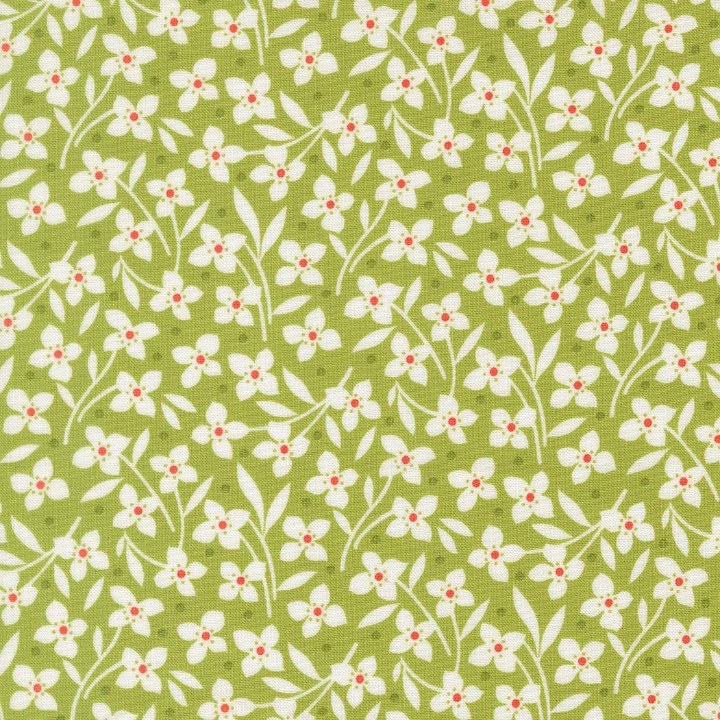 a repeating pattern of white flowers with red centers against a green background.
