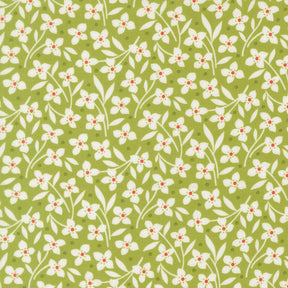 a repeating pattern of white flowers with red centers against a green background.