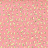 a pattern of pink and yellow leaves scattered across a pink background.