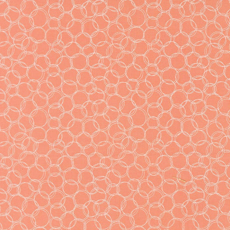 a repeating pattern of overlapping white circles on a peach-colored background.