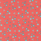 a pattern of small blue and white flowers scattered across a bright red background.