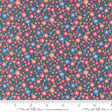 The image is a close-up of a fabric with a floral pattern, featuring small red, pink, and blue flowers scattered across a dark blue background.