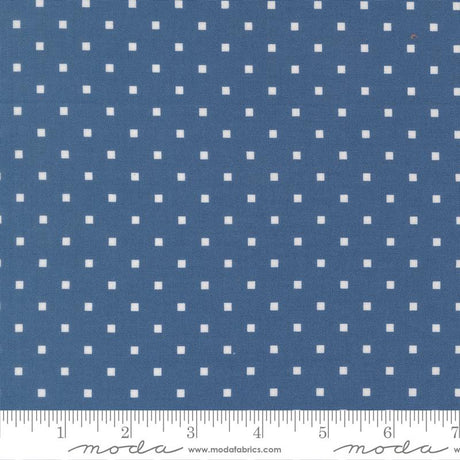 a close-up view of a fabric with a blue background and white polka dots. The fabric appears to be a type of material with a dotted pattern, possibly used for clothing or home decor.