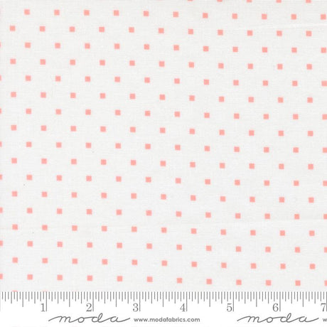a fabric with a repeating pattern of small pink squares on a white background.