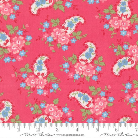 The image is a vibrant red fabric with a repeating paisley pattern of pink and blue flowers and leaves.