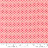 a repeating pattern of pink flowers on a fabric surface.