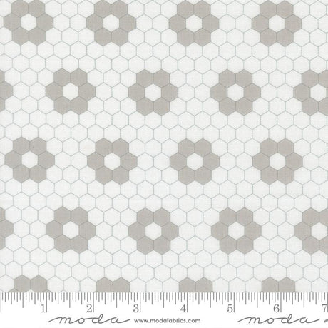 a repeating pattern of hexagonal shapes in various shades of gray and white, creating a visually striking and geometric design.