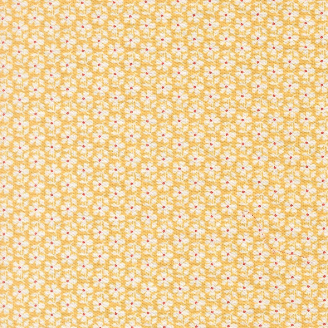 a repeating pattern of yellow flowers with red centers, creating a visually appealing and vibrant design.