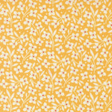 a repeating pattern of white flowers with red centers against a yellow background.