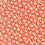 a repeating pattern of white flowers with green centers against a red background.