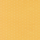 a repeating pattern of small white dots on a yellow background.