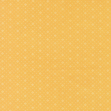 a repeating pattern of small white dots on a yellow background.
