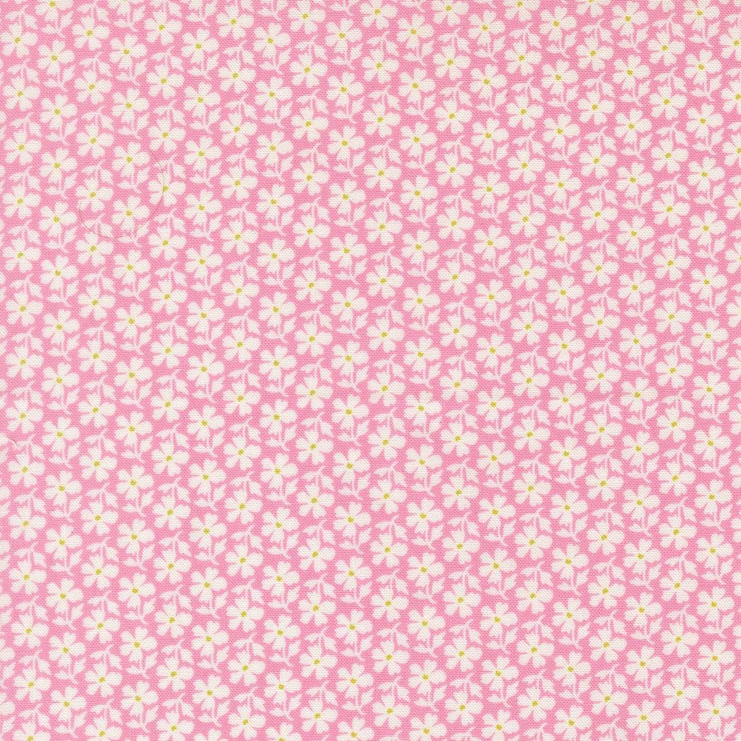 a repeating pattern of white flowers on a pink background.