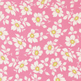 a repeating pattern of white and yellow flowers against a pink background.