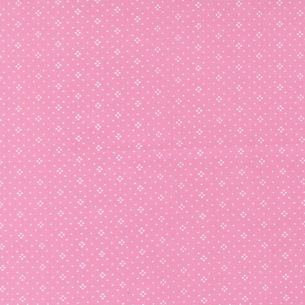 The image is a pink background with small white dots arranged in a pattern.