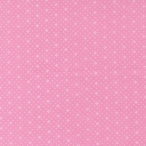 The image is a pink background with small white dots arranged in a pattern.