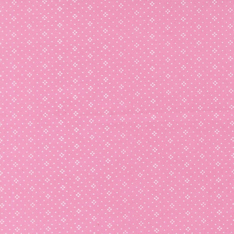 The image is a pink background with small white dots arranged in a pattern.