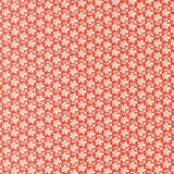 a repeating pattern of red flowers with white centers, creating a visually striking and symmetrical design.