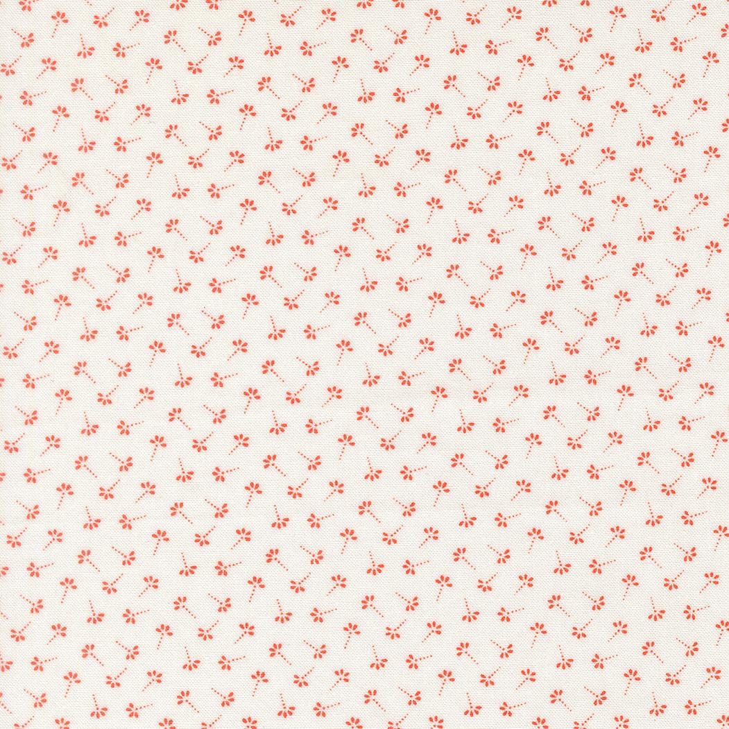a repeating pattern of small red flowers or leaves on a light-colored background.