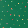 a variety of colorful fruits, including apples, oranges, and cherries, scattered across a green background.
