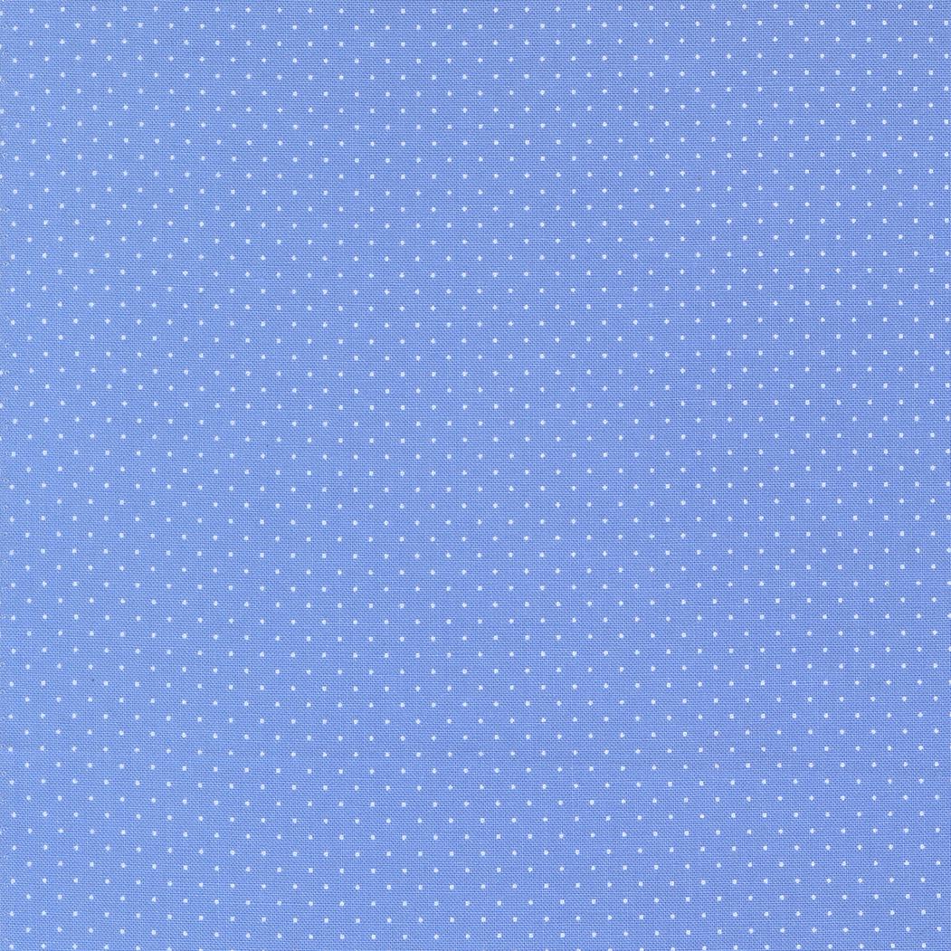 The image is a blue background with small white dots or stars scattered across it, creating a polka dot pattern.