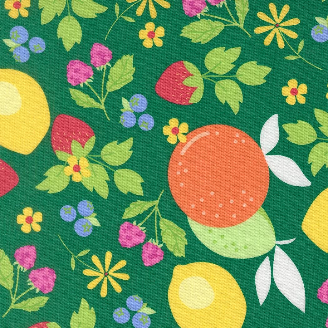 The image is a vibrant and colorful pattern featuring various fruits and flowers on a green background.