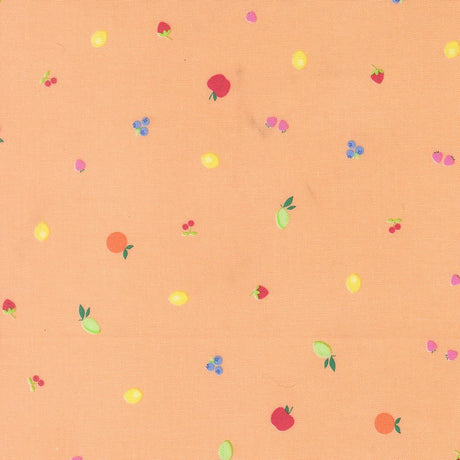 a pattern of various fruits, including apples, oranges, and cherries, scattered across a peach-colored background.