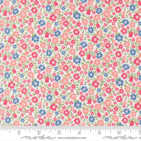 a fabric with a floral pattern in shades of pink, blue, and green. The fabric appears to be a light-colored material, possibly cotton or linen, with a repeating pattern of small flowers and leaves. The image does not contain any text or additional objects, and the focus is on the floral pattern.