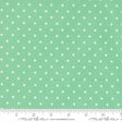 a fabric with a green background and white polka dots.