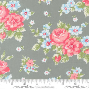 a gray fabric with a floral pattern of pink and white flowers.