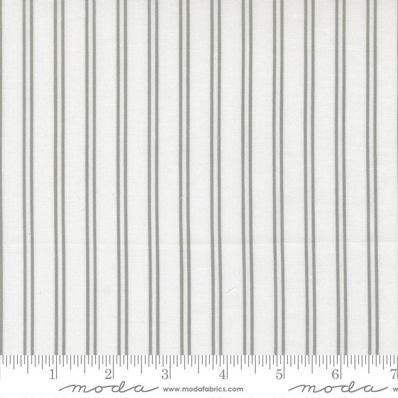 The image is a close-up of a fabric with vertical gray stripes.