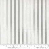 The image is a close-up of a fabric with vertical gray stripes.