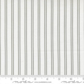 The image is a close-up of a fabric with vertical gray stripes.