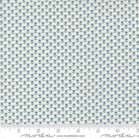 a fabric with a repeating pattern of blue flowers on a white background. The pattern is arranged in a grid-like fashion, creating a visually appealing and intricate design.