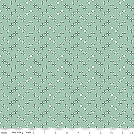 a repeating pattern of small green and white flowers on a light green background.