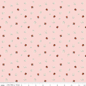 a repeating pattern of small ladybugs and flowers on a light pink background.