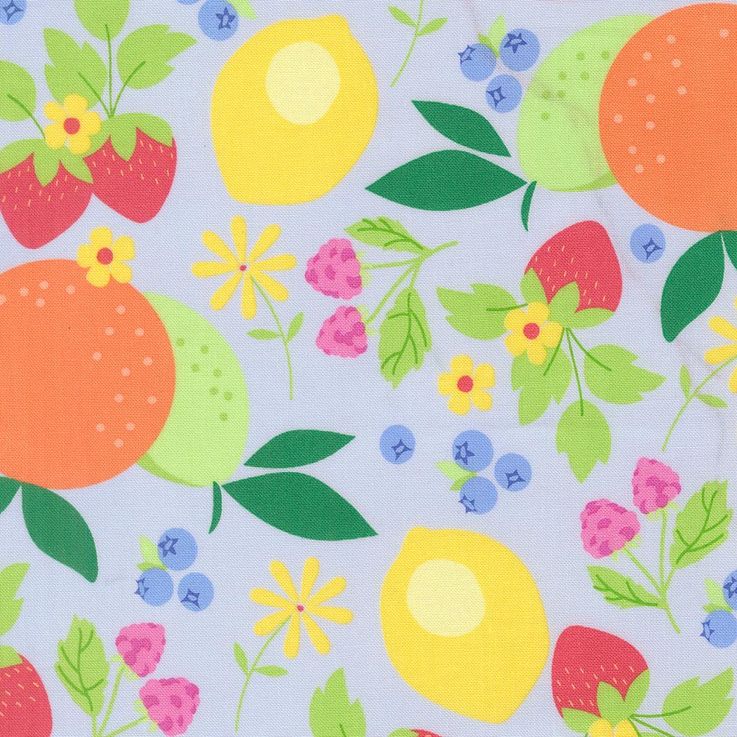 The image is a vibrant and colorful pattern featuring various fruits and flowers, including oranges, lemons, strawberries, blueberries, and daisies, all set against a light blue background.