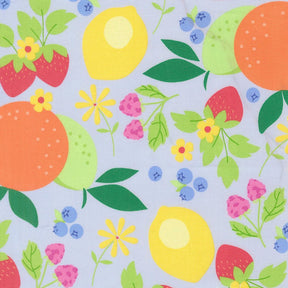 The image is a vibrant and colorful pattern featuring various fruits and flowers, including oranges, lemons, strawberries, blueberries, and daisies, all set against a light blue background.
