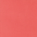 The image is a red background with small white dots, creating a polka dot pattern.