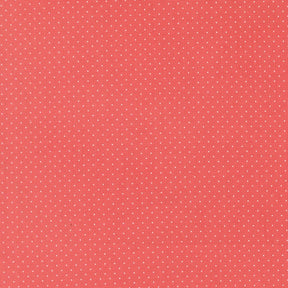 The image is a red background with small white dots, creating a polka dot pattern.